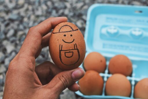 Egg with a drawn smiley face and hat