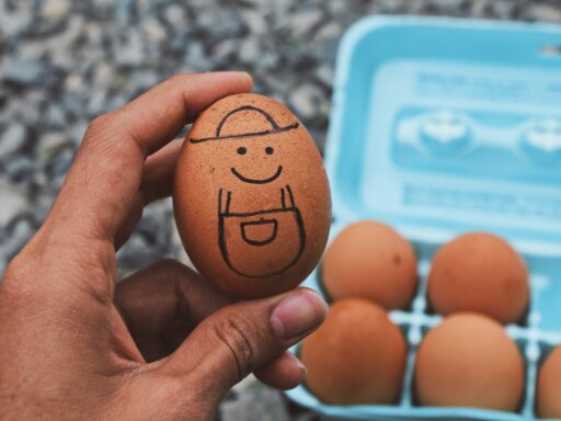 Egg with a drawn smiley face and hat
